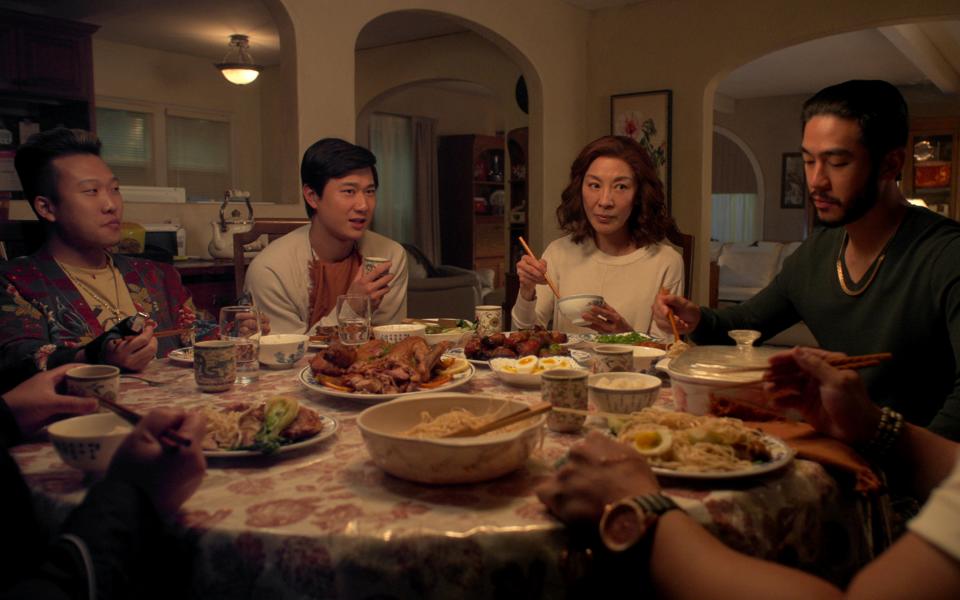 The Brothers Sun. (L to R) Joon Lee as TK, Sam Song Li as Bruce Sun, Michelle Yeoh as Mama Sun, Justin Chien as Charles Sun in episode 104 of The Brothers Sun. Cr. Courtesy of Netflix © 2023