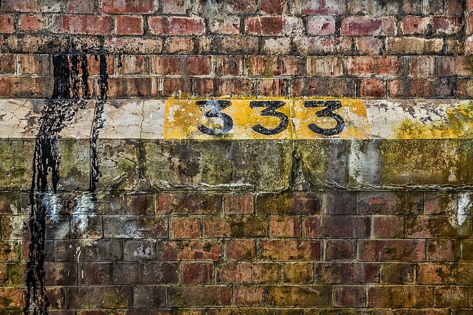 number 333 on brick wall