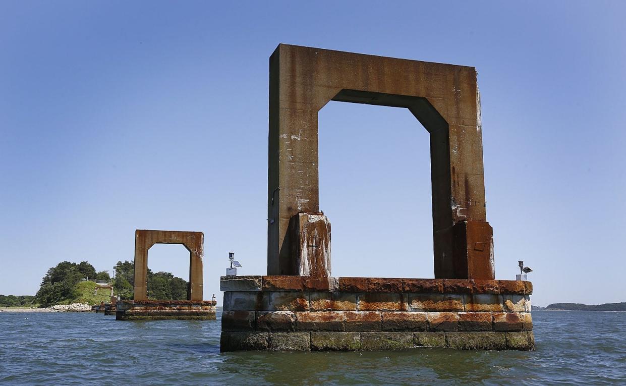 A view of the bridge supports for the Long Island Bridge from Moon Island looking toward Long Island in Quincy Bay on Sunday, July 21, 2019.