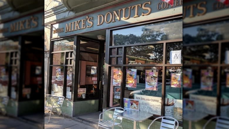 Storefront with metal chairs outside