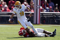 Kent State quarterback Collin Schlee (19) is sacked by Georgia linebacker Jamon Dumas-Johnson (10) in the first half of anNCAA college football game Saturday, Sept. 24, 2022, in Athens, Ga. (AP Photo/ John Bazemore)