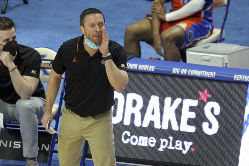 Florida head coach Mike White yells to his team during the first half of an NCAA college basketball game against Kentucky in Lexington, Ky., Saturday, Feb. 27, 2021. (AP Photo/James Crisp)