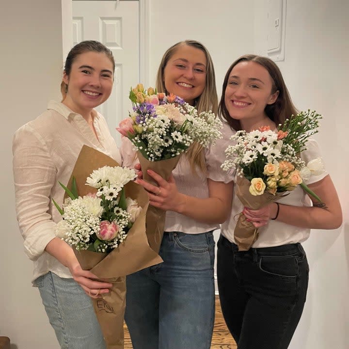 Women holding flowers