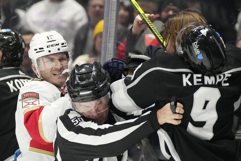 Florida Panthers left wing Matthew Tkachuk, left, and Los Angeles Kings center Adrian Kempe scuffle during the first period of an NHL hockey game Thursday, Nov. 16, 2023, in Los Angeles. (AP Photo/Mark J. Terrill)