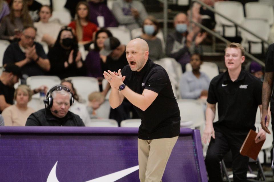 ACU head coach Brette Tanner celebrates in the second half of the Wildcats' win over Cal Baptist.