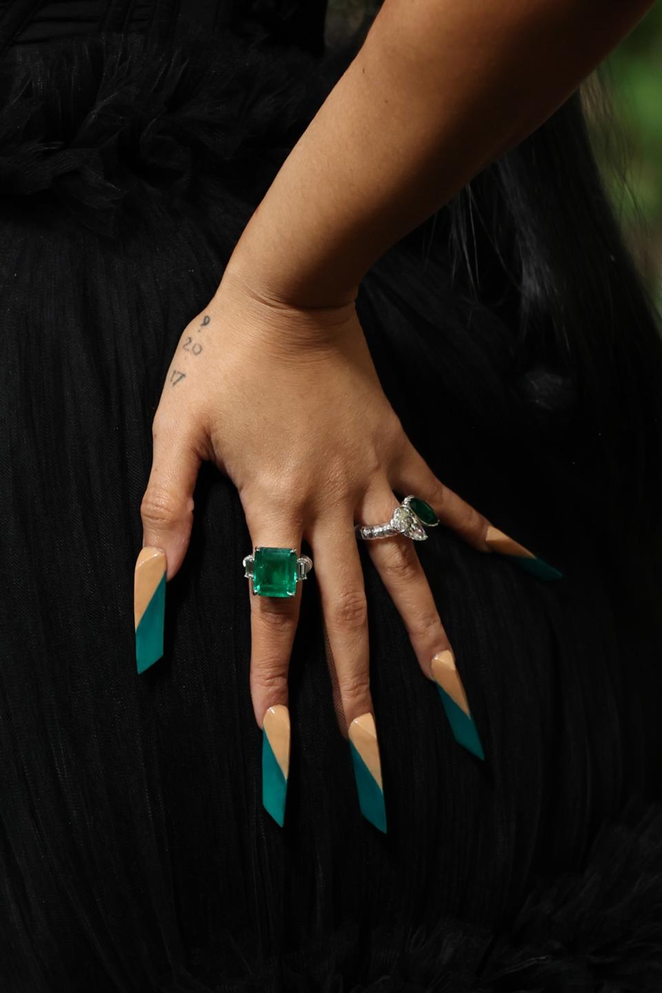 Cardi B wearing a very thick triangular manicure to the 2024 Met Gala.