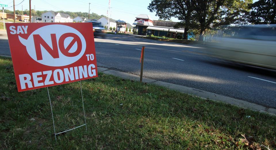 A sign faces South New Hope Road at the entrance to Cramer Woods Friday morning; Oct. 15; 2021.