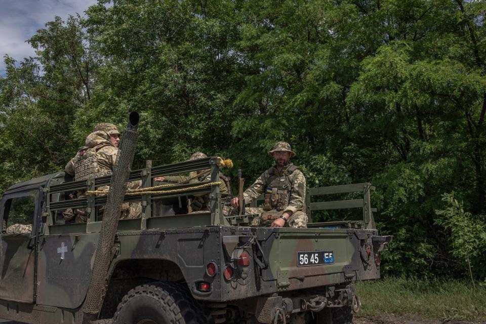 Ukrainian servicemen ride on a Humvee military pickup truck in the Donetsk region, on 17 June 2024 (AFP via Getty Images)