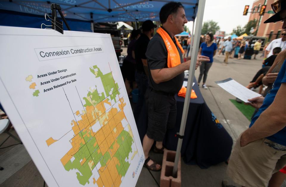 A sign shows a map of Fort Collins Connexion construction areas at a booth at Taste of Fort Collins in Fort Collins, Colo. on Saturday, July 24, 2021. 
