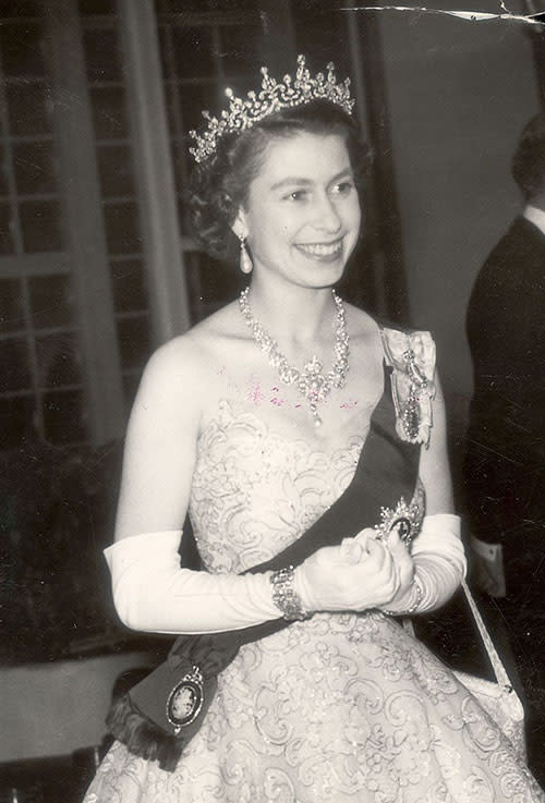 In 1953 the Queen and the Duke of Edinburgh attended a concert at the Royal Festival Hall arranged by Australia and New Zealand. The Queen wore a crinoline-type evening gown with needle-run silver lace and pink tulle, over which sat the ribbon Order of the Garter.
