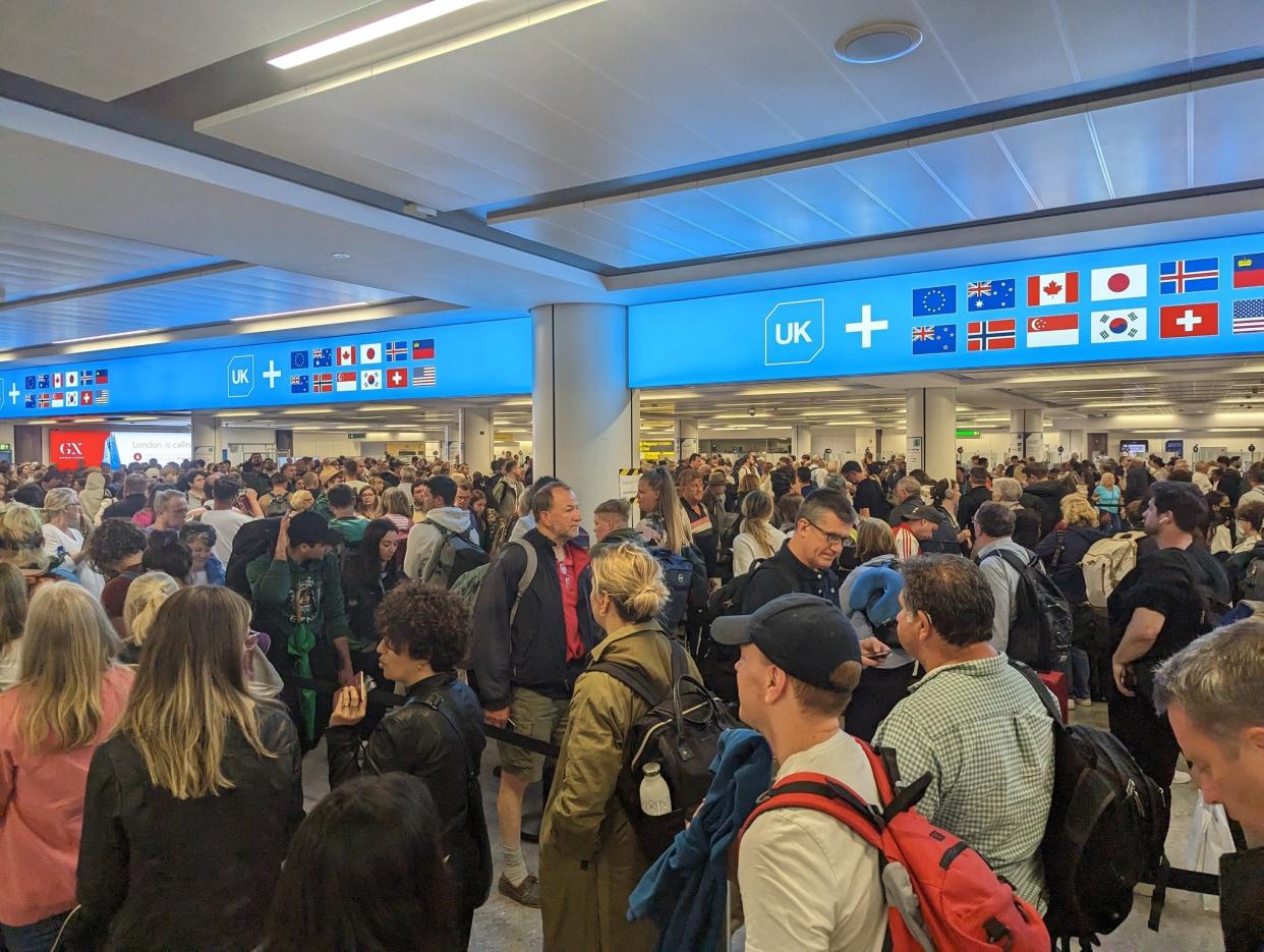 The traveller posted a series of pictures of people waiting at border control in long queues on Twitter, with the caption, “Absolute chaos at Gatwick” (@theburnxngwolf / Twitter)