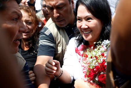 Peruvian presidential candidate Keiko Fujimori of Fuerza Popular (Popular Force) party greets supporters after a meeting with local leaders in San Juan de Lurigancho in Lima, Peru, May 10, 2016. REUTERS/Mariana Bazo