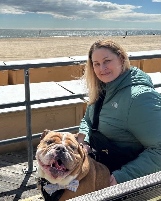 Alexis Walling, co-founder of Doggie Road Trippin' on Instagram, and her English bulldog named Buckley.