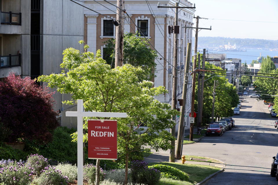 A "For Sale" sign is posted outside a residential home in the Queen Anne neighborhood of Seattle, Washington, U.S. May 14, 2021. REUTERS/Karen Ducey