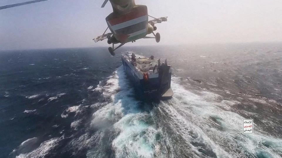 PHOTO: Houthi military helicopter flies over the Galaxy Leader cargo ship in the Red Sea in this photo released, Nov. 20, 2023. (Houthi Military Media via Reuters, FILE)