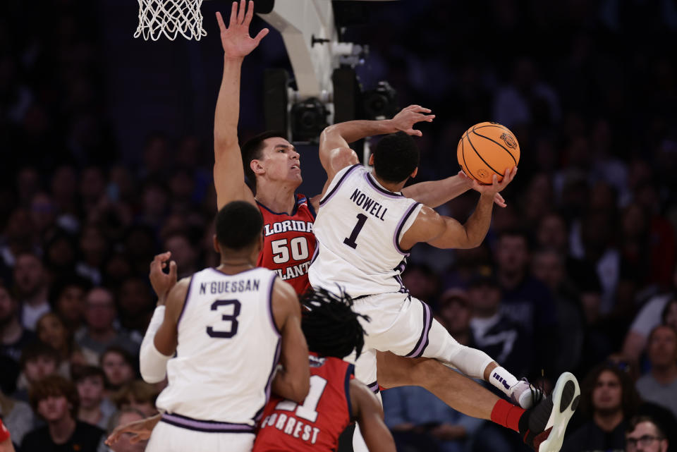 Kansas State's Markquis Nowell (1) tries too shoot against Florida Atlantic's Vladislav Goldin (50) in the second half of an Elite 8 college basketball game in the NCAA Tournament's East Region final, Saturday, March 25, 2023, in New York. (AP Photo/Adam Hunger)