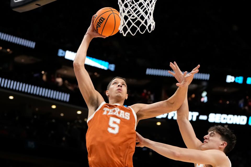 Texas forward Kadin Shedrick dunks during Saturday night's second-round loss to Tennesse in the NCAA Tournament. Shedrick said after the loss that he intends to come back next season.