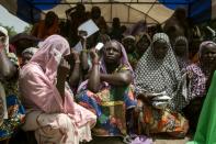 Women wait for food distribution in the town of Banki in northeastern Nigeria in April 2017 as conflict and the risk of famine heighten