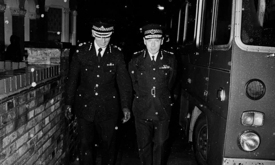 Sir Kenneth Newman, right, arriving at the Broadwater Farm estate, Tottenham, north London, in 1985.