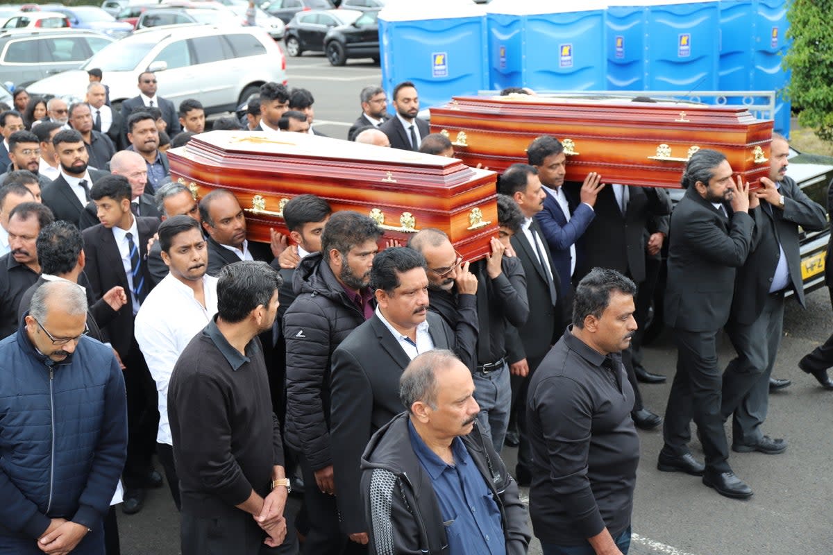 The coffins of Reuven Simon and Joseph Sebastian are brought from St Mary’s Church in Ardmore (Joe Boland/PA) (PA Wire)