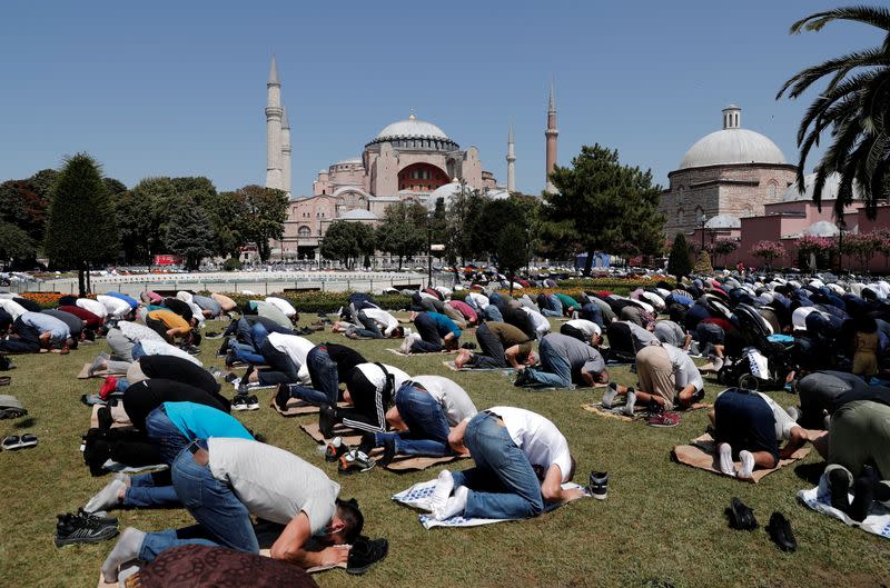 FILE PHOTO: Worshippers attend Friday prayers outside Hagia Sophia Grand Mosque in Istanbul