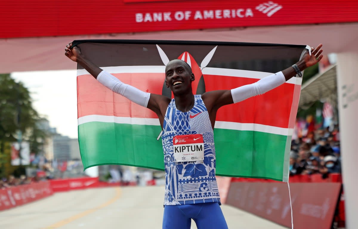 Kelvin Kiptum celebrates winning the Chicago Marathon and breaking the world record  (AP)