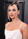 <p>The 'New Rules' singer paired her slicked back noughties style bun with sky blue sparkly eyeshadow for the Grammy Awards 2020.</p>