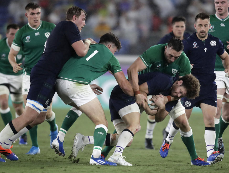 Scotland's Duncan Taylor is tackled by Ireland's Jack Conan during the Rugby World Cup Pool A game at International Stadium between Ireland and Scotland in Yokohama, Japan, Sunday, Sept. 22, 2019. (AP Photo/Jae Hong)