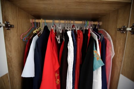 Li Doudou's "Hanfu" are seen in a wardrobe at her rental home in Hebei province, China