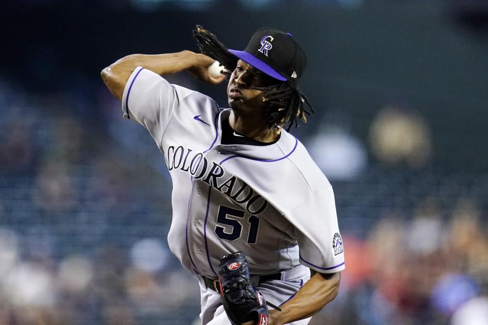 Colorado Rockies starting pitcher Jose Urena throws against the Arizona Diamondbacks during the first inning of a baseball game Sunday, Aug. 7, 2022, in Phoenix. (AP Photo/Ross D. Franklin)