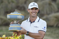 Billy Horschel holds his trophy after winning the Dell Technologies Match Play Championship golf tournament Sunday, March 28, 2021, in Austin, Texas. (AP Photo/David J. Phillip)