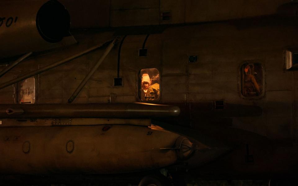 A young hostage is seen through the window of a helicopter arriving at Tel Aviv's Schneider children's hospital