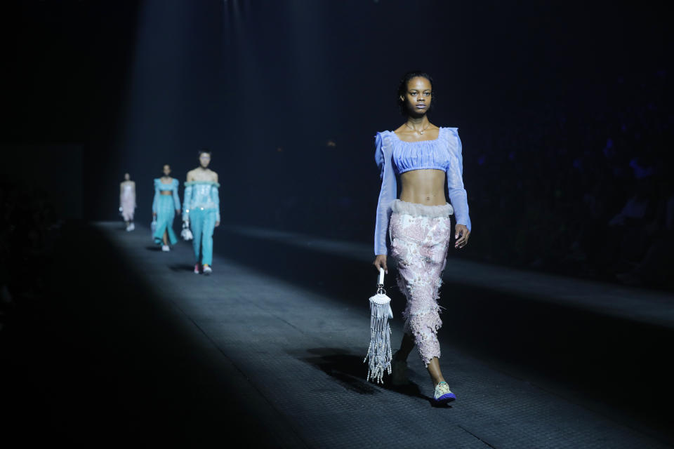 Models wear creations for the Kenzo mens Spring-Summer 2020 fashion collection presented in Paris, Sunday, June 23 2019. (AP Photo/Michel Euler)