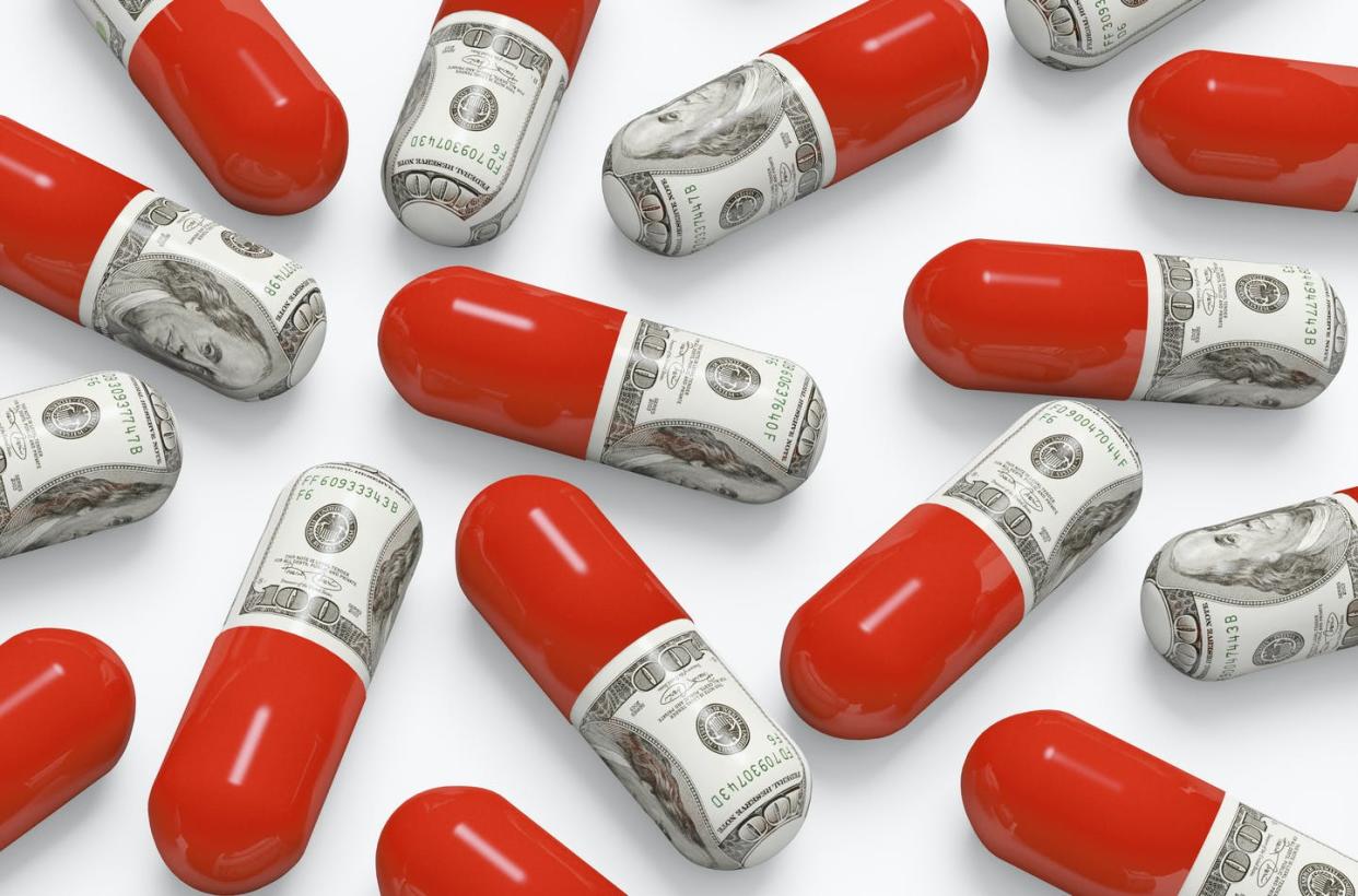 <span class="caption">The average price for an orphan drug is more than $150,000 per year.</span> <span class="attribution"><a class="link " href="https://www.gettyimages.com/detail/photo/pills-decorated-with-dollar-bills-royalty-free-image/155292424?adppopup=true" rel="nofollow noopener" target="_blank" data-ylk="slk:GP Kidd/Cultura/Getty Images;elm:context_link;itc:0;sec:content-canvas">GP Kidd/Cultura/Getty Images</a></span>