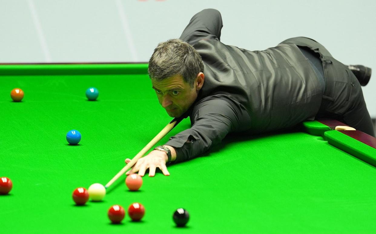 Ronnie O'Sullivan plays a shot during his match with Ryan Day, on day nine of the 2024 Cazoo World Snooker Championship at the Crucible Theatre, Sheffield