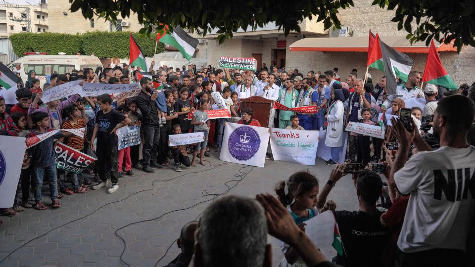 Members of a hospital's medical staff in Deir al-Balah join a rally to thank pro-Palestinian students in the US on May 1, 2024. - AFP/Getty Images