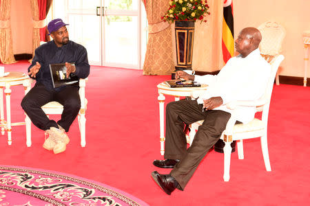 Rapper Kanye West (L) meets Uganda's President Yoweri Museveni when he paid a courtesy call at State House, Entebbe, Uganda October 15, 2018. Presidential Press Unit/Handout via REUTERS