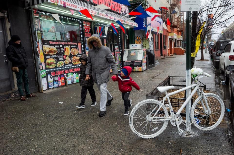 A memorial ghost bike stands in memory of Jose Alvarado, a delivery worker killed by a hit-and-run driver in the South Bronx.