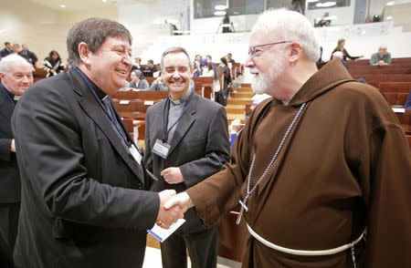 U.S. cardinal Sean Patrick O'Malley talks with Brazilian cardinal Joao Braz de Aviz (L) before the start of the "Safeguarding in Homes and Schools" seminar at the Pontifical Gregorian University in Rome, Italy March 23, 2017. REUTERS/Max Rossi