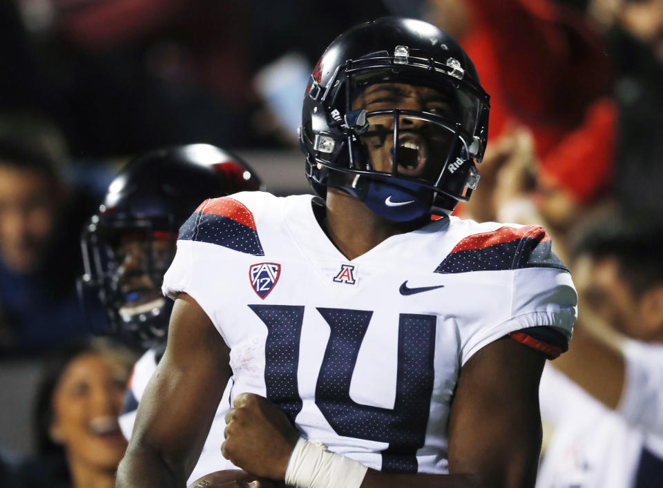 Arizona quarterback Khalil Tate celebrates after rushing for a touchdown against Colorado in the second half of an NCAA college football game Saturday, Oct. 7, 2017, in Boulder, Colo. Arizona won 45-42. (AP Photo/David Zalubowski)