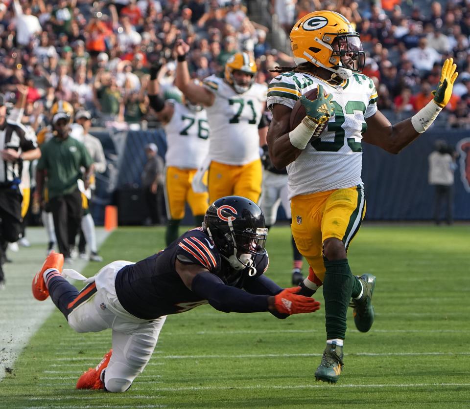 Green Bay Packers running back Aaron Jones (33) picks up 51 yards on reception while Chicago Bears safety Eddie Jackson (4) misses a tackle.