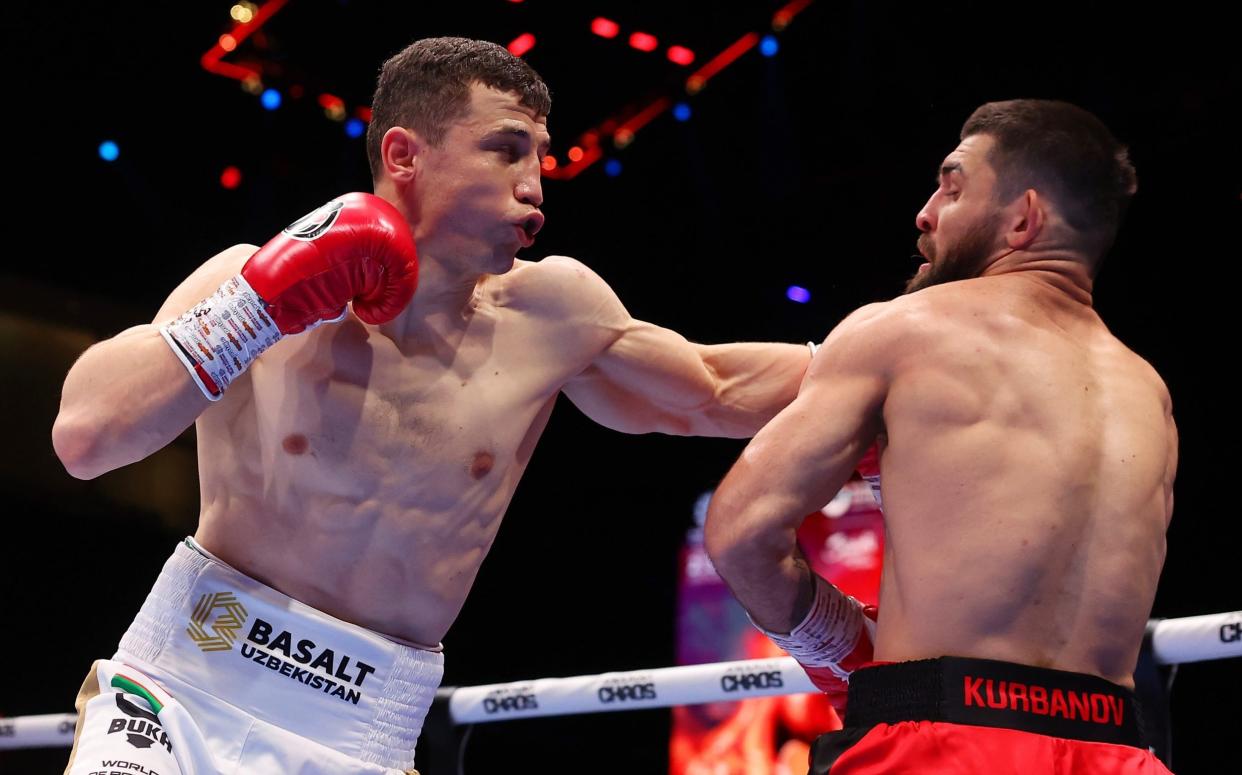 Israil Madrimov punches Magomed Kurbanov during the WBA World Super Welterweight title fight between Israil Madrimov and Magomed Kurbanov on the Knockout Chaos boxing card at the Kingdom Arena on March 08, 2024 in Riyadh, Saudi Arabia