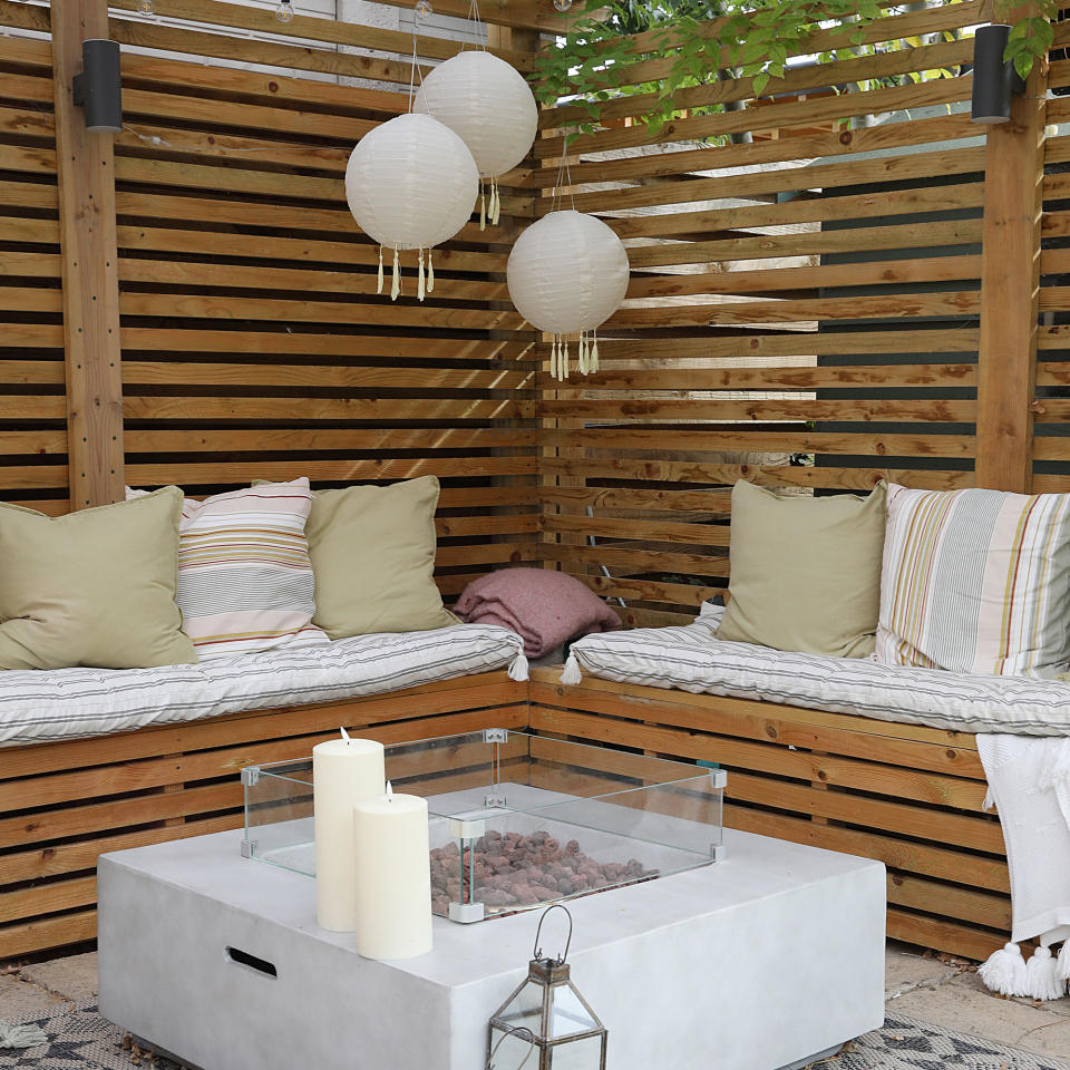 Garden bench under wooden awning