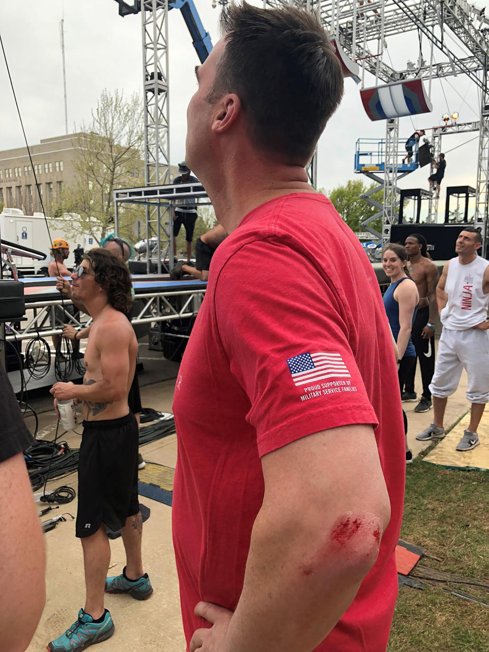 In this Wednesday, April 10, 2019 photo shows Oklahoma's new Republican Gov. Kevin Stitt looks up a the "American Ninja Warrior" set outside the state Capitol in Oklahoma City, Okal., after trying out the obstacle course. Organizers of the reality television show that features high-level athletes racing through grueling obstacles say the 47-year-old ex-CEO is the first governor to give the course a try. Stitt bloodied his elbow completing a rope swing to a landing pad after jumping across a pool of water. (Baylee Lakey/Office of Governor Kevin Stitt via AP)