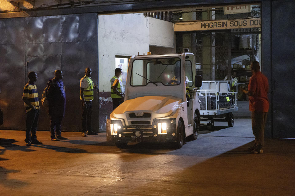 The casket containing the body of Ousmane Sylla, who died in Italy, is repatriated to Conakry, Guinea, Monday, April 8, 2024. (AP Photo/Misper Apawu)