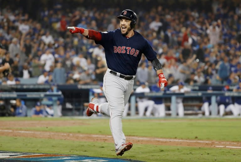 MVP: Red Sox slugger Steve Pearce celebrates his eighth-inning home run against the Los Angeles Dodgers in Boston's World Series clinching game five triumph