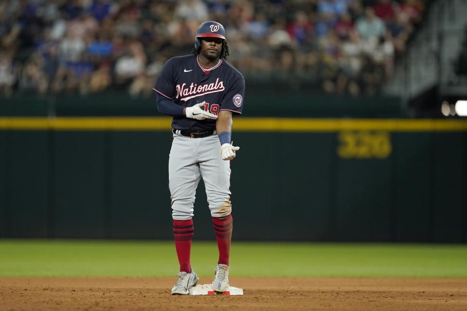 Washington Nationals' Josh Bell looks to the dugout as he stands on second after hitting a double in the sixth inning of a baseball game against the Texas Rangers, Friday, June 24, 2022, in Arlington, Texas. (AP Photo/Tony Gutierrez)