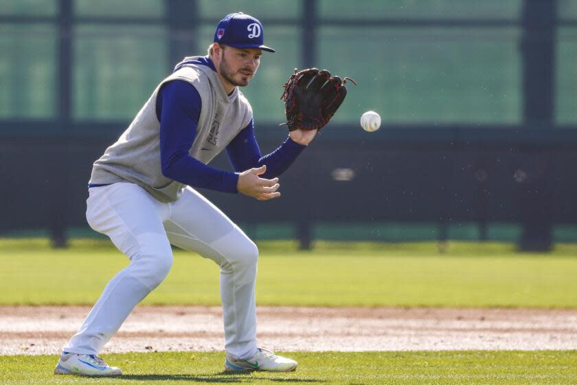 Goodyear, Arizona, Thursday, February 15, 2024 - Dodgers infielder Gavin Lux fields grounders.