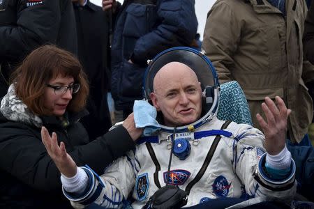 U.S. astronaut Scott Kelly reacts shortly after landing near the town of Dzhezkazgan (Zhezkazgan), Kazakhstan, March 2, 2016. REUTERS/Kirill Kudryavtsev/Pool