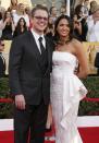 Actor Matt Damon and his wife Luciana Bozan Barroso arrive at the 20th annual Screen Actors Guild Awards in Los Angeles, California January 18, 2014. REUTERS/Lucy Nicholson (UNITED STATES - Tags: ENTERTAINMENT) (SAGAWARDS-ARRIVALS)